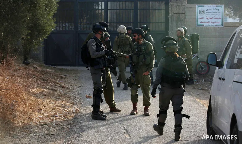 Palestinians clash with Israeli soldiers over an Israeli order to shut down a Palestinian school in the West Bank city of Nablus, on October 15, 2018. Photo by Shadi Jarar'ah
