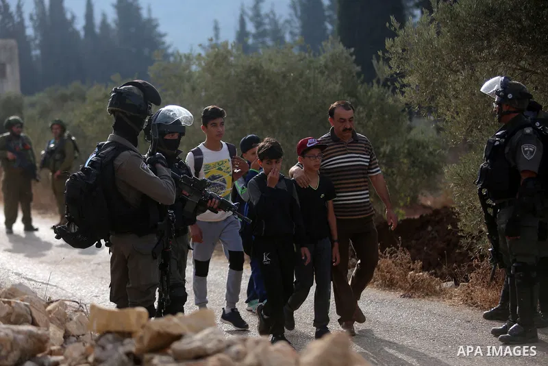 Palestinians clash with Israeli soldiers over an Israeli order to shut down a Palestinian school in the West Bank city of Nablus, on October 15, 2018. Photo by Shadi Hatem