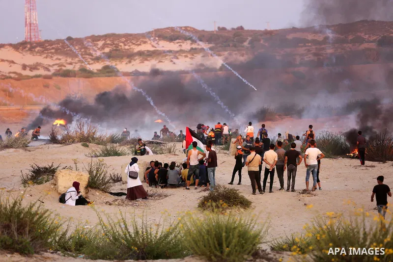 Palestinian protesters gather during clashes with Israeli forces in a demonstration against the Israeli blockade on Gaza Strip, along the Gaza sea barrier on the maritime border with Israel near Kibbutz Zikim, north of B...