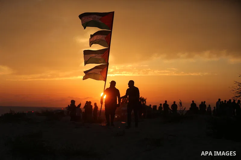 Palestinian protesters gather during clashes with Israeli forces in a demonstration against the Israeli blockade on Gaza Strip, along the Gaza sea barrier on the maritime border with Israel near Kibbutz Zikim, north of B...