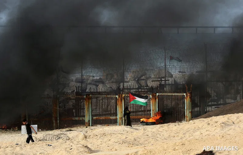 Palestinian protesters gather during clashes with Israeli forces in a demonstration against the Israeli blockade on Gaza Strip, along the Gaza sea barrier on the maritime border with Israel near Kibbutz Zikim, north of B...