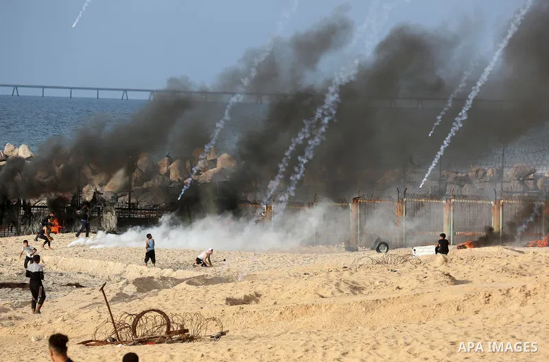 Palestinian protesters gather during clashes with Israeli forces in a demonstration against the Israeli blockade on Gaza Strip, along the Gaza sea barrier on the maritime border with Israel near Kibbutz Zikim, north of B...