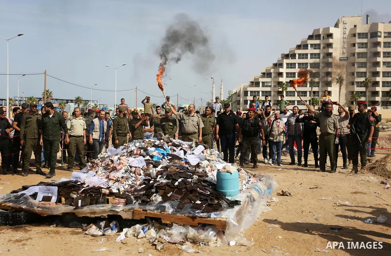 Members of Palestinian anti-drug police burn drugs during the annual conference for the destruction of narcotics, in Gaza City on October 22, 2018. Photo by Ashraf Amra