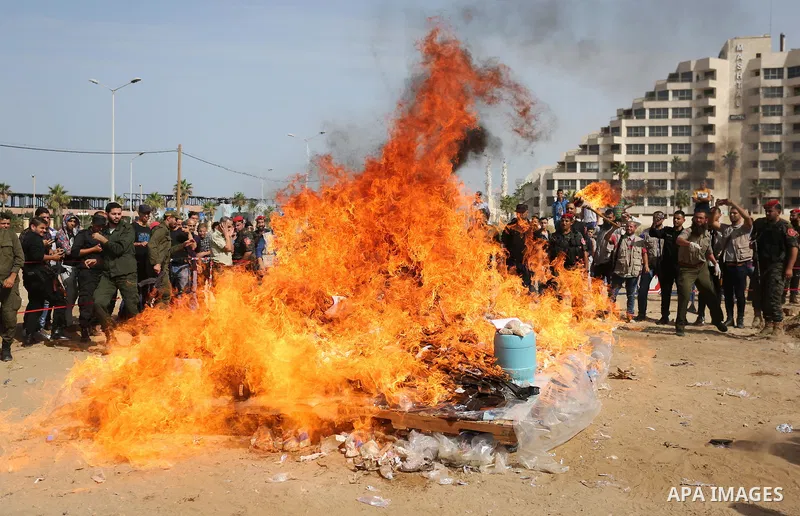 Members of Palestinian anti-drug police burn drugs during the annual conference for the destruction of narcotics, in Gaza City on October 22, 2018. Photo by Ashraf Amra