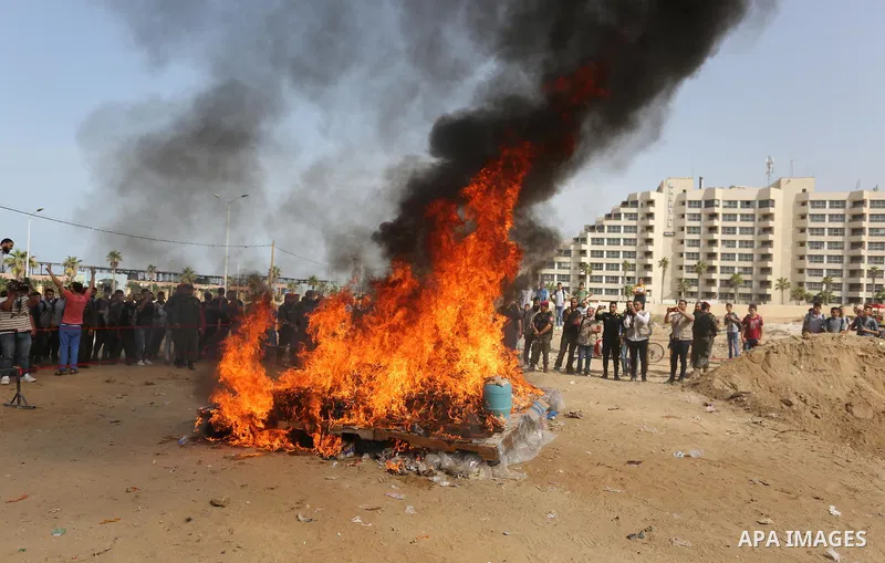 Members of Palestinian anti-drug police burn drugs during the annual conference for the destruction of narcotics, in Gaza City on October 22, 2018. Photo by Ashraf Amra