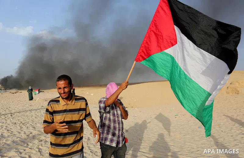 Palestinian protesters gather during clashes with Israeli forces in a demonstration against the Israeli blockade on Gaza Strip, along the Gaza sea barrier on the maritime border with Israel near Kibbutz Zikim, north of B...