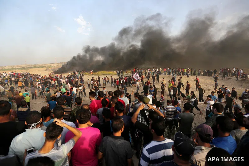 Palestinian protesters gather during clashes with Israeli forces in a demonstration against the Israeli blockade on Gaza Strip, along the Gaza sea barrier on the maritime border with Israel near Kibbutz Zikim, north of B...