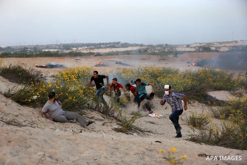 Palestinian protesters gather during clashes with Israeli forces in a demonstration against the Israeli blockade on Gaza Strip, along the Gaza sea barrier on the maritime border with Israel near Kibbutz Zikim, north of B...
