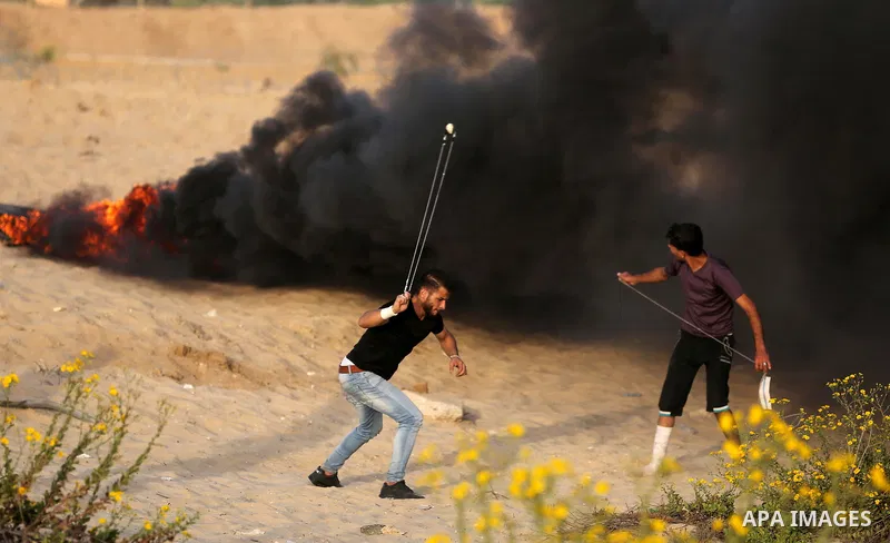 Palestinian protesters gather during clashes with Israeli forces in a demonstration against the Israeli blockade on Gaza Strip, along the Gaza sea barrier on the maritime border with Israel near Kibbutz Zikim, north of B...