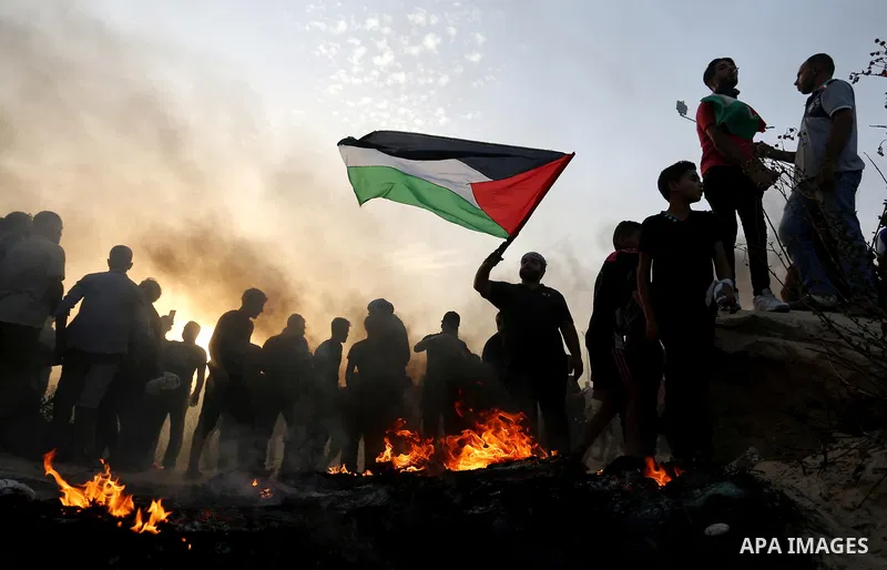Palestinian protesters gather during clashes with Israeli forces in a demonstration against the Israeli blockade on Gaza Strip, along the Gaza sea barrier on the maritime border with Israel near Kibbutz Zikim, north of B...