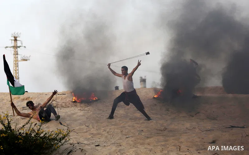 Palestinian protesters gather during clashes with Israeli forces in a demonstration against the Israeli blockade on Gaza Strip, along the Gaza sea barrier on the maritime border with Israel near Kibbutz Zikim, north of B...