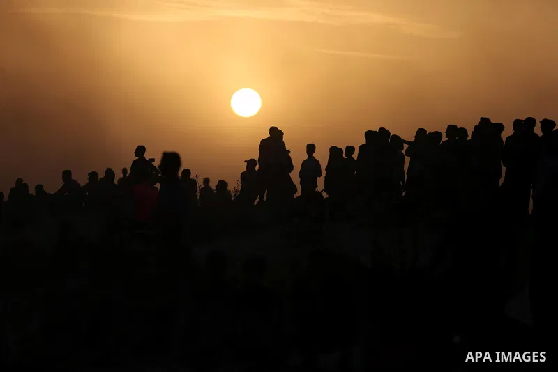 Palestinian protesters gather during clashes with Israeli forces in a demonstration against the Israeli blockade on Gaza Strip, along the Gaza sea barrier on the maritime border with Israel near Kibbutz Zikim, north of B...