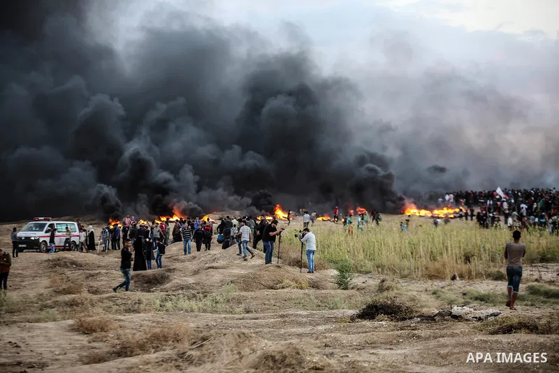 Palestinian protesters gather during clashes with Israeli troops in tents protest where Palestinians demand the right to return to their homeland at the Israel-Gaza border, in east of Gaza City on October 26, 2018. Photo...
