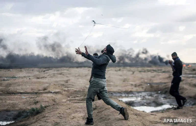 Palestinian protesters gather during clashes with Israeli troops in tents protest where Palestinians demand the right to return to their homeland at the Israel-Gaza border, in east of Gaza City on October 26, 2018. Photo...