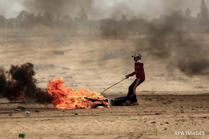 Palestinian protesters gather during clashes with Israeli troops in tents protest where Palestinians demand the right to return to their homeland at the Israel-Gaza border, in Rafah in the southern Gaza Strip on October...