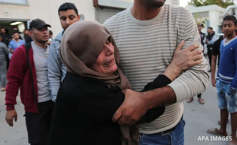 Relatives of Palestinians who were shot dead by Israeli forces during clashes with Israeli troops in tents protest where Palestinians demand the right to return to their homeland at the Israel-Gaza border, mourn in a hos...