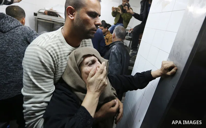 Relatives of Palestinians who were shot dead by Israeli forces during clashes with Israeli troops in tents protest where Palestinians demand the right to return to their homeland at the Israel-Gaza border, mourn in a hos...