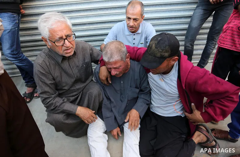 Relatives of Palestinians who were shot dead by Israeli forces during clashes with Israeli troops in tents protest where Palestinians demand the right to return to their homeland at the Israel-Gaza border, mourn in a hos...