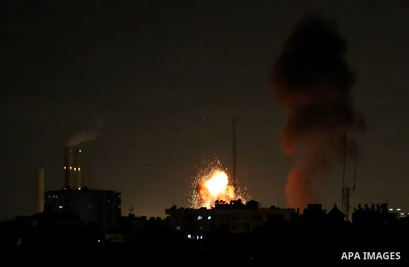 This picture taken on October 27, 2018 shows a fireball exploding during Israeli air strikes in Gaza City. A barrage of rockets from Gaza hit Israel overnight, the Israeli army said on October 27, with Israel retaliating...
