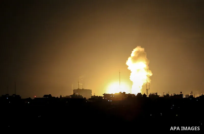 This picture taken on October 27, 2018 shows a fireball exploding during Israeli air strikes in Gaza City. A barrage of rockets from Gaza hit Israel overnight, the Israeli army said on October 27, with Israel retaliating...