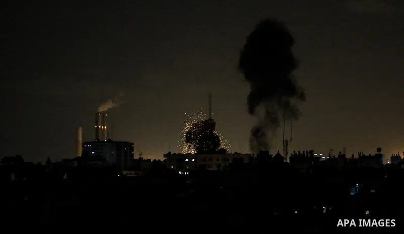 This picture taken on October 27, 2018 shows a fireball exploding during Israeli air strikes in Gaza City. A barrage of rockets from Gaza hit Israel overnight, the Israeli army said on October 27, with Israel retaliating...