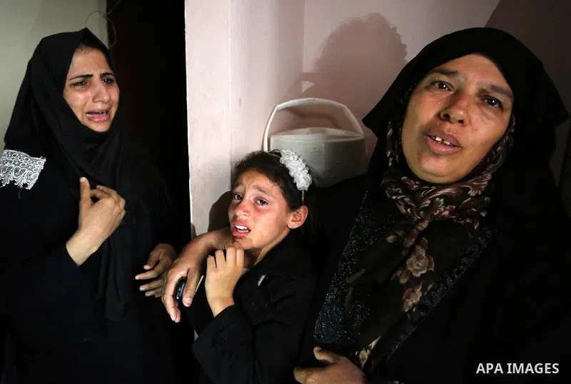 Relatives of Palestinian Ahmed Abu Lebda, 22, who was shot dead by Israeli forces during clashes in tents protest where Palestinians demand the right to return to their homeland at the Israel-Gaza border, mourn during hi...
