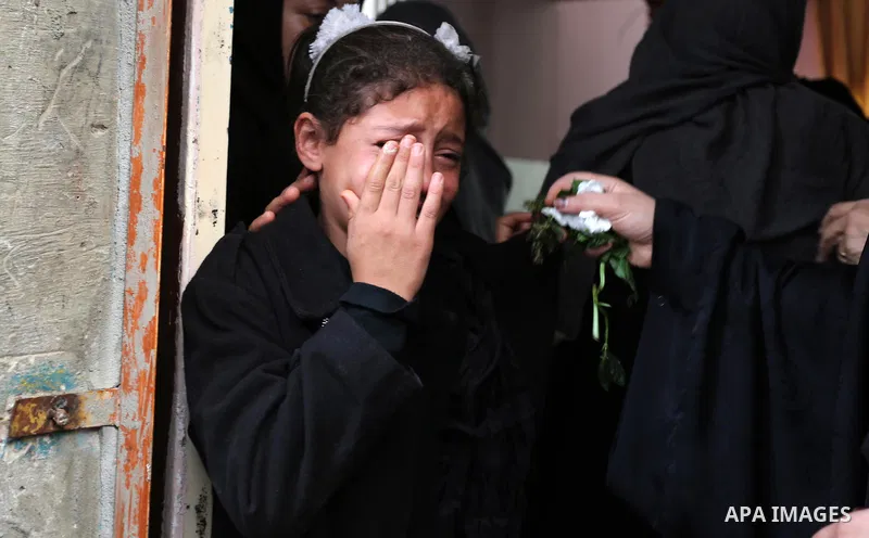 Relatives of Palestinian Ahmed Abu Lebda, 22, who was shot dead by Israeli forces during clashes in tents protest where Palestinians demand the right to return to their homeland at the Israel-Gaza border, mourn during hi...