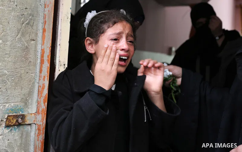 Relatives of Palestinian Ahmed Abu Lebda, 22, who was shot dead by Israeli forces during clashes in tents protest where Palestinians demand the right to return to their homeland at the Israel-Gaza border, mourn during hi...