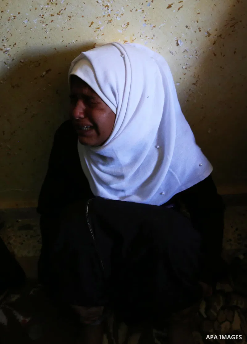 A relative of Palestinian Yahya el-Hassanat, 37, who was shot dead by Israeli troops during clashes in tents protest where Palestinian demand rights to return to their homeland at Israel-Gaza border, mourns during his fu...