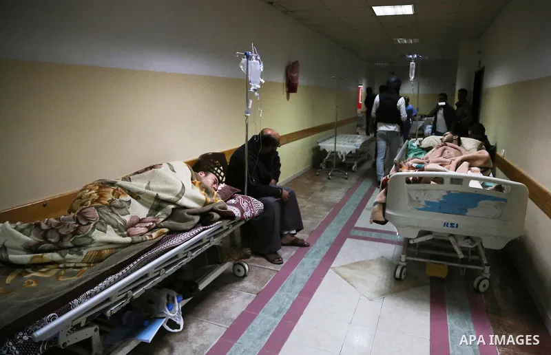 The picture taken on October 27, 2018 shows Palestinian patients lie on the beds in a corridor at Indonesia hospital after an Israeli air strike in northern of Gaza Strip. A barrage of rockets from Gaza hit Israel overni...