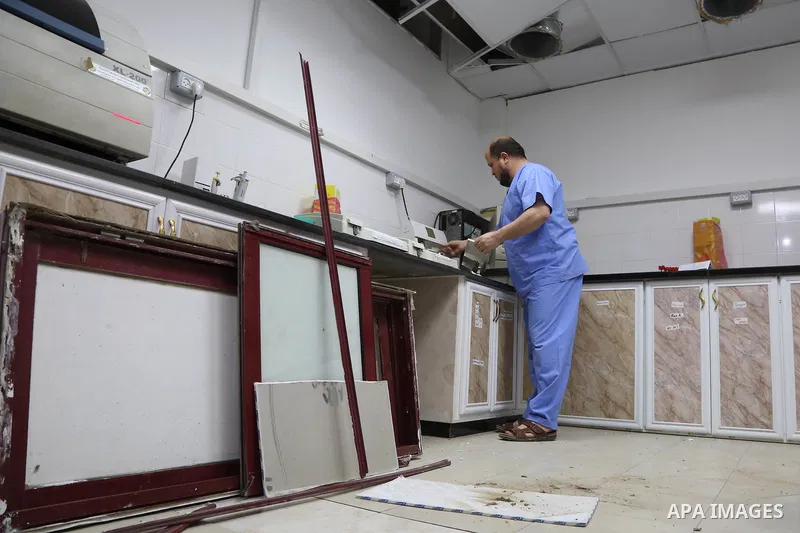 The picture taken on October 27, 2018 shows A Palestinian inspects the damaged of Indonesia hospital after an Israeli air strike in northern of Gaza Strip. A barrage of rockets from Gaza hit Israel overnight, the Israeli...