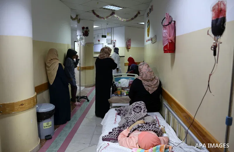 The picture taken on October 27, 2018 shows Palestinian patients lie on the beds in a corridor at Indonesia hospital after an Israeli air strike in northern of Gaza Strip. A barrage of rockets from Gaza hit Israel overni...