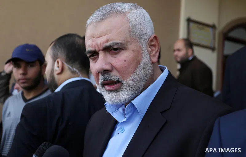 Palestinian Hamas Chief Ismail Haniyeh attends the funeral of three Palestinian teenagers who were killed in an Israeli air strike on the Gaza Strip during their funeral in Deir el-Balah in central of the Gaza Strip on O...