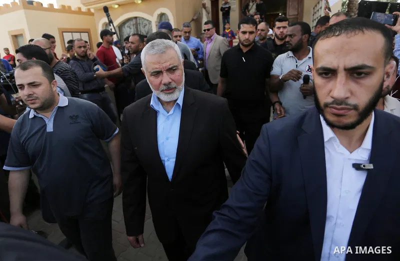 Palestinian Hamas Chief Ismail Haniyeh attends the funeral of three Palestinian teenagers who were killed in an Israeli air strike on the Gaza Strip during their funeral in Deir el-Balah in central of the Gaza Strip on O...