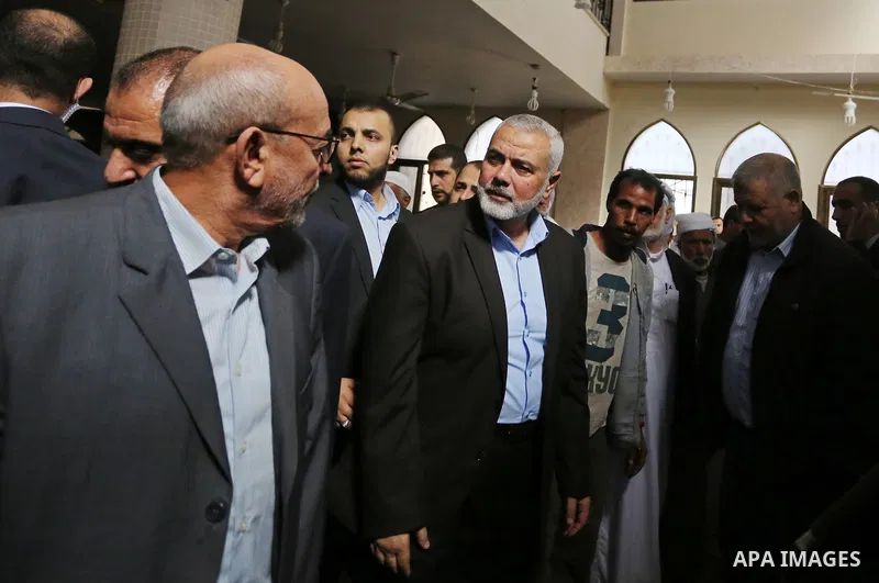 Palestinian Hamas Chief Ismail Haniyeh attends the funeral of three Palestinian teenagers who were killed in an Israeli air strike on the Gaza Strip during their funeral in Deir el-Balah in central of the Gaza Strip on O...