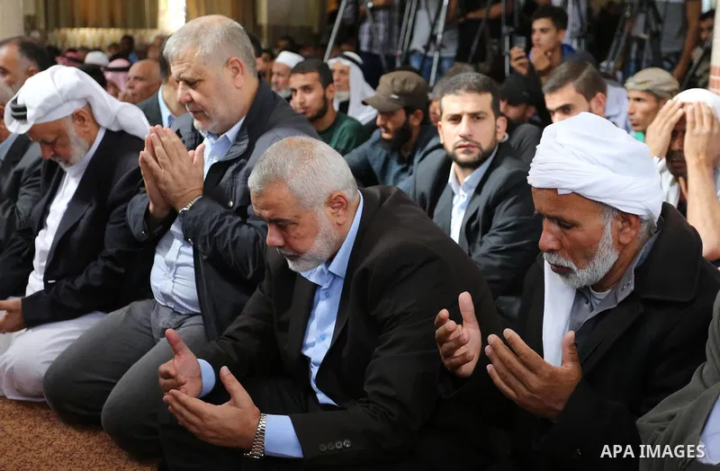Palestinian Hamas Chief Ismail Haniyeh attends the funeral of three Palestinian teenagers who were killed in an Israeli air strike on the Gaza Strip during their funeral in Deir el-Balah in central of the Gaza Strip on O...