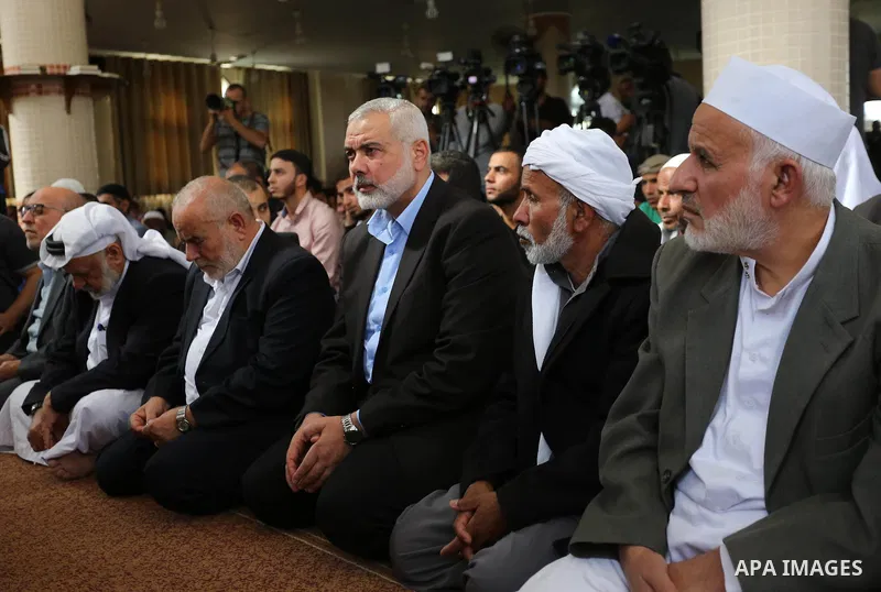 Palestinian Hamas Chief Ismail Haniyeh attends the funeral of three Palestinian teenagers who were killed in an Israeli air strike on the Gaza Strip during their funeral in Deir el-Balah in central of the Gaza Strip on O...
