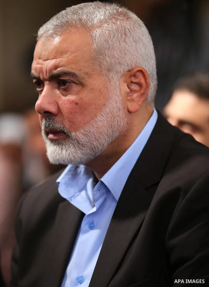 Palestinian Hamas Chief Ismail Haniyeh attends the funeral of three Palestinian teenagers who were killed in an Israeli air strike on the Gaza Strip during their funeral in Deir el-Balah in central of the Gaza Strip on O...