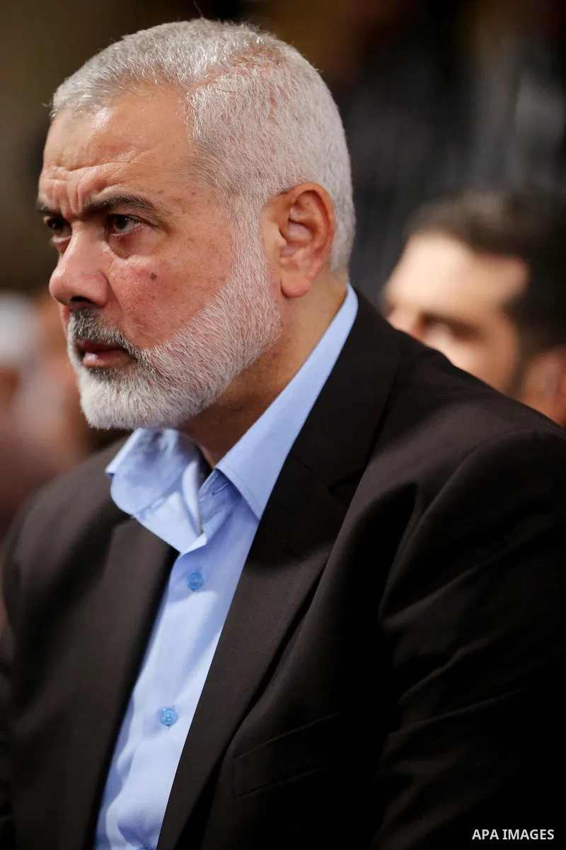 Palestinian Hamas Chief Ismail Haniyeh attends the funeral of three Palestinian teenagers who were killed in an Israeli air strike on the Gaza Strip during their funeral in Deir el-Balah in central of the Gaza Strip on O...