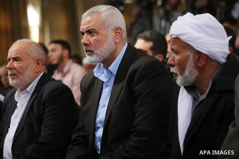 Palestinian Hamas Chief Ismail Haniyeh attends the funeral of three Palestinian teenagers who were killed in an Israeli air strike on the Gaza Strip during their funeral in Deir el-Balah in central of the Gaza Strip on O...