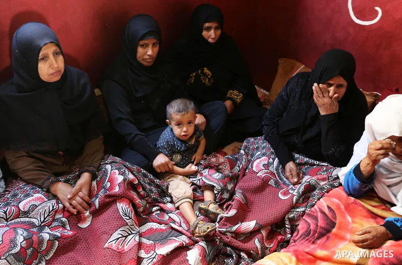 Relatives of Palestinian teenager Khaled Saed, who was killed in an Israeli air strike on the Gaza Strip , mourn during his funeral in Deir el-Balah in central of the Gaza Strip on October 29, 2018. Photo by Ashraf Amra
