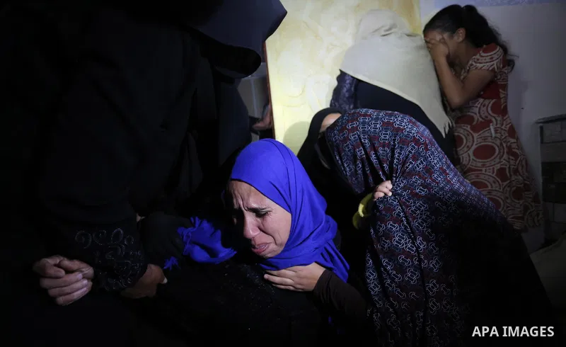 Relatives of Palestinian teenager Khaled Saed, who was killed in an Israeli air strike on the Gaza Strip , mourn during his funeral in Deir el-Balah in central of the Gaza Strip on October 29, 2018. Photo by Ashraf Amra