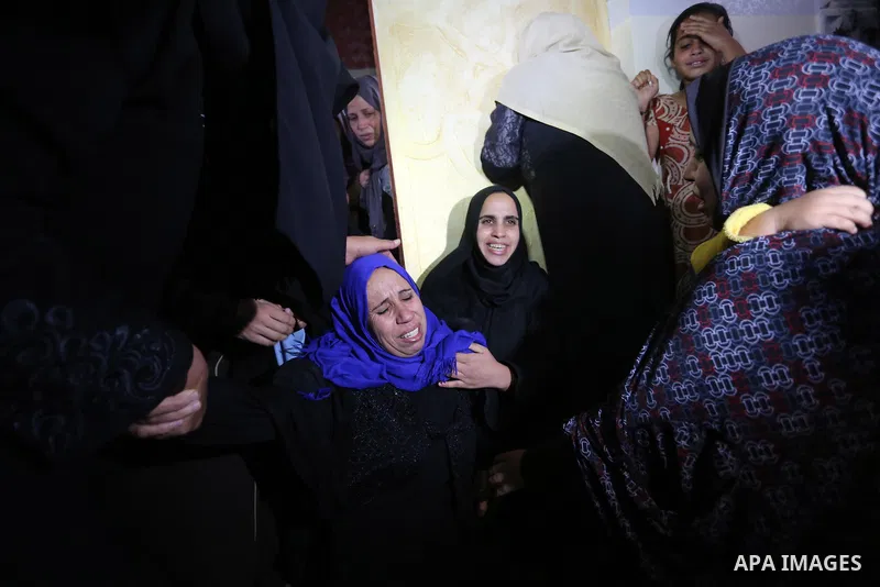 Relatives of Palestinian teenager Khaled Saed, who was killed in an Israeli air strike on the Gaza Strip , mourn during his funeral in Deir el-Balah in central of the Gaza Strip on October 29, 2018. Photo by Ashraf Amra