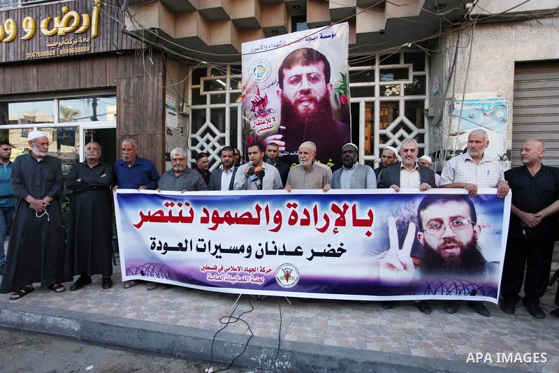 Palestinians take part during a protest to show solidarity with Islamic Jihad member Khader Adnan, after he break his hunger strike at Israeli jails, in Gaza City on October 29, 2018. Photo by Mahmoud Ajjour