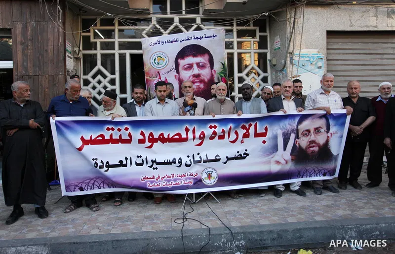 Palestinians take part during a protest to show solidarity with Islamic Jihad member Khader Adnan, after he break his hunger strike at Israeli jails, in Gaza City on October 29, 2018. Photo by Mahmoud Ajjour