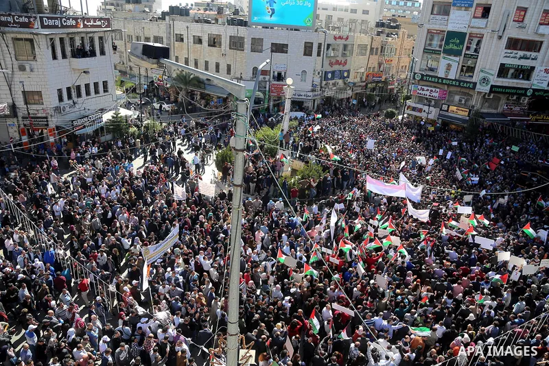 Palestinians take part during a protest against a social security law, in the West Bank city of Ramallah on October 29, 2018. Photo by Shadi Hatem