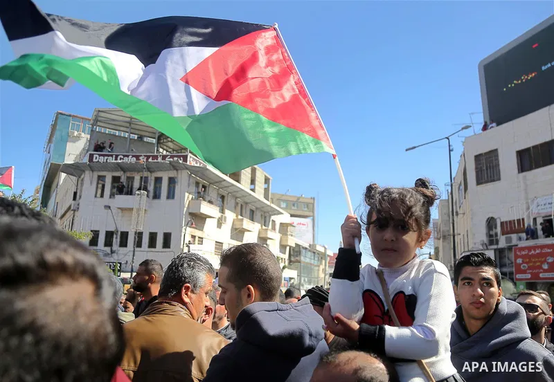Palestinians take part during a protest against a social security law, in the West Bank city of Ramallah on October 29, 2018. Photo by Shadi Hatem