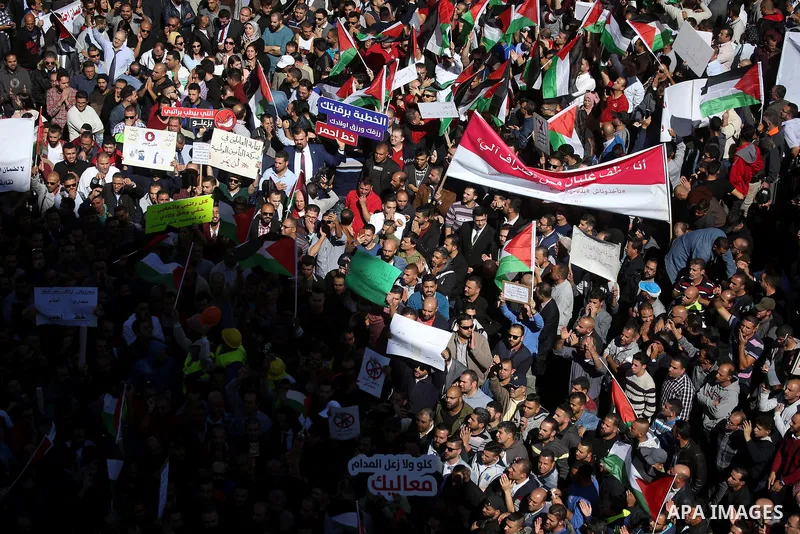 Palestinians take part during a protest against a social security law, in the West Bank city of Ramallah on October 29, 2018. Photo by Shadi Hatem