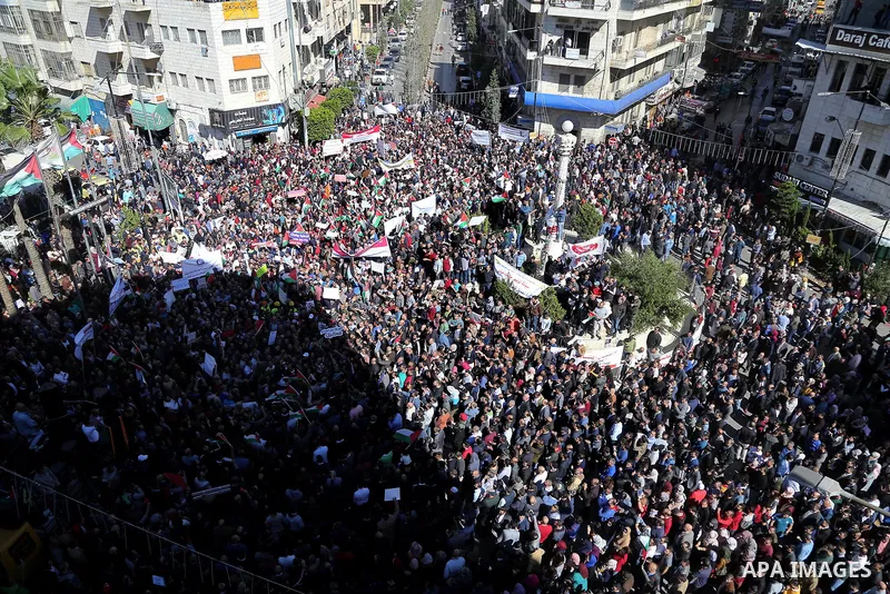 Palestinians take part during a protest against a social security law, in the West Bank city of Ramallah on October 29, 2018. Photo by Shadi Hatem