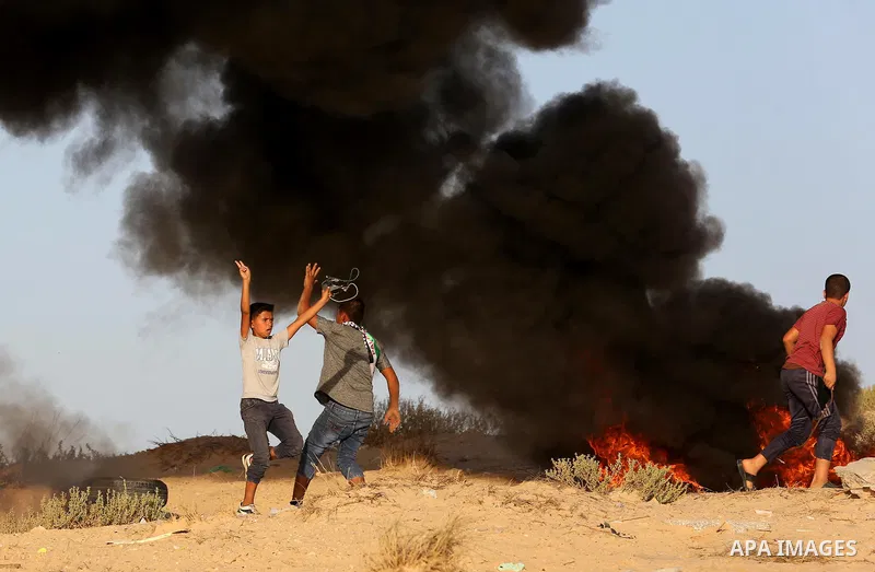 Palestinian protesters gather during clashes with Israeli forces in a demonstration against the Israeli blockade on Gaza Strip, along the Gaza sea barrier on the maritime border with Israel near Kibbutz Zikim, north of B...
